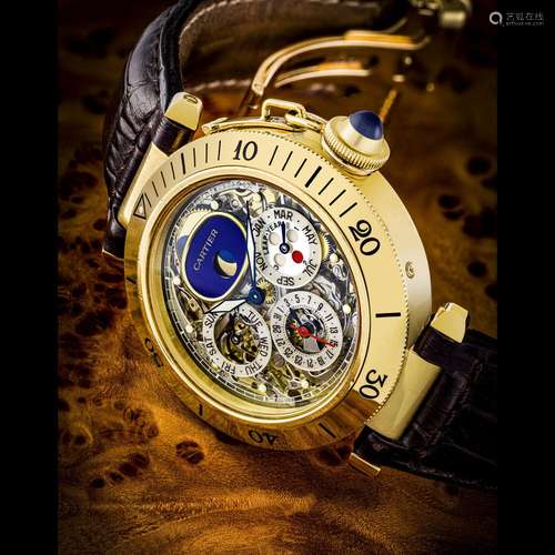 CARTIER. A RARE 18K GOLD AUTOMATIC SEMI-SKELETONISED TOURBIL...