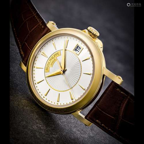 PATEK PHILIPPE. AN 18K GOLD AUTOMATIC WRISTWATCH WITH SWEEP ...