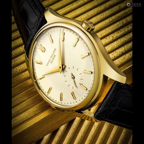 PATEK PHILIPPE. A RARE 18K GOLD AUTOMATIC WRISTWATCH WITH EN...