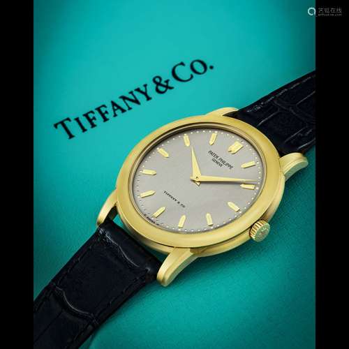 PATEK PHILIPPE. A RARE 18K GOLD AUTOMATIC WRISTWATCH , RETAI...