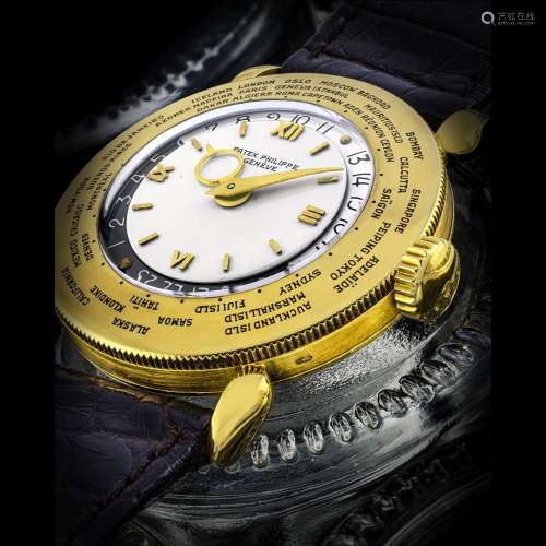 PATEK PHILIPPE. A SUPERB AND VERY RARE 18K GOLD WORLD TIME W...