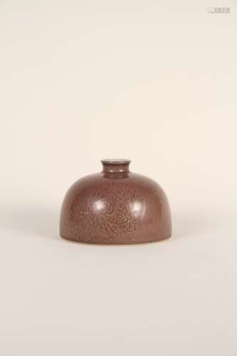 A Chinese 17th-18th century red glaze is darkly engraved wit...