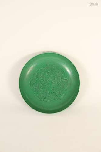 A Chinese 19th-century green-glazed dark engraving disc
