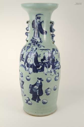 A large vase of blue and white figures from the 20th century...