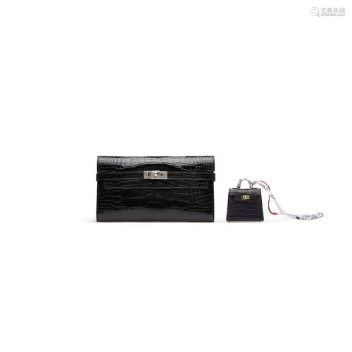 A SET OF TWO: A SHINY BLACK ALLIGATOR KELLY WALLET WITH PALL...