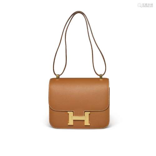 A GOLD EPSOM LEATHER CONSTANCE 24 WITH GOLD HARDWAREHERMÈS, ...