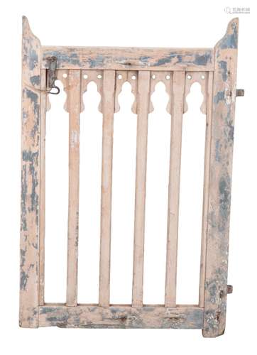 A PAINTED AND DISTRESSED WOODEN GATE