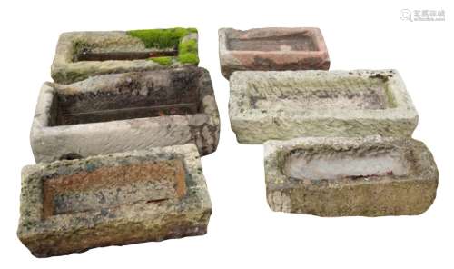 A GROUP OF SIX SMALL STONE TROUGHS