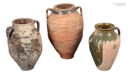 A GROUP OF THREE TERRACOTTA AMPHORAE