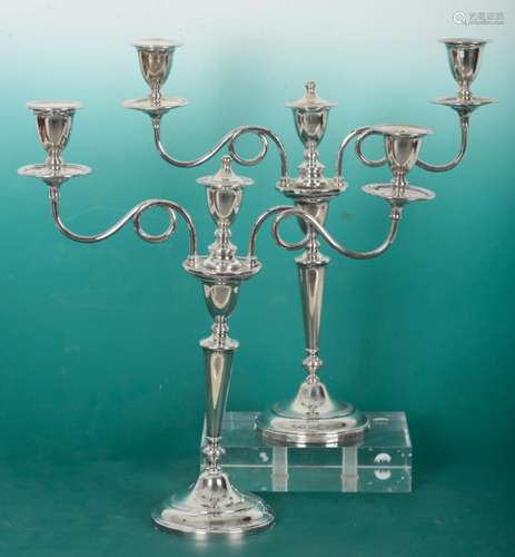 A PAIR OF ELIZABETH II SILVER THREE SCONCE CANDLEBRA OF NEO-...