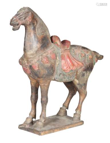 A CHINESE TANG DYNASTY STYLE CARVED AND PAINTED WOOD HORSE