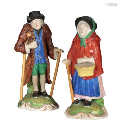 A PAIR OF 18TH CENTURY ENGLISH PORCELAIN FIGURES - AN ELDERL...