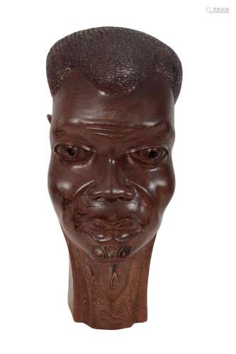 A CARVED WOOD AFRICAN HEAD
