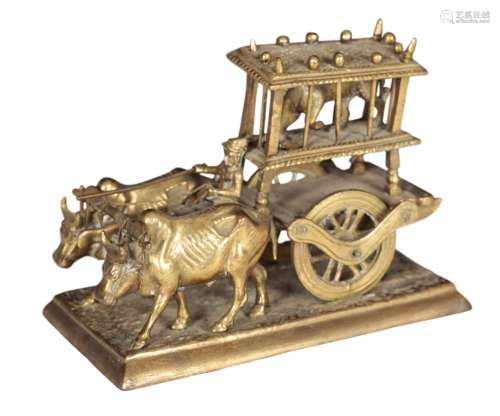 A BRASS MODEL OF OX PULLING A CART WITH A CAGED LEOPARD