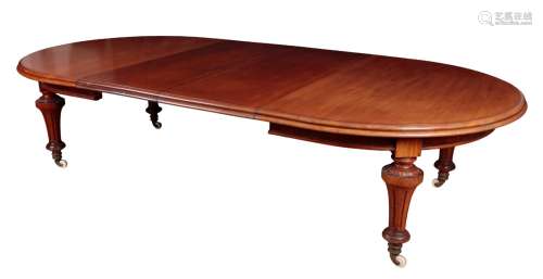 A VICTORAN MAHOGANY OVAL EXTENDING DINING TABLE