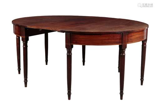 A REGENCY MAHOGANY OVAL DINING TABLE