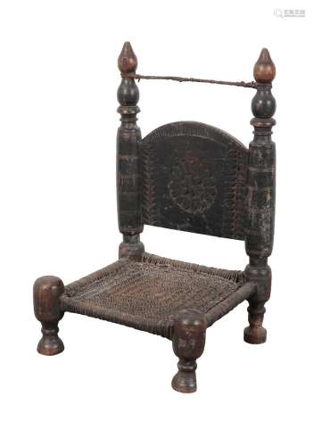 AN INDIAN EBONISED CHAIR