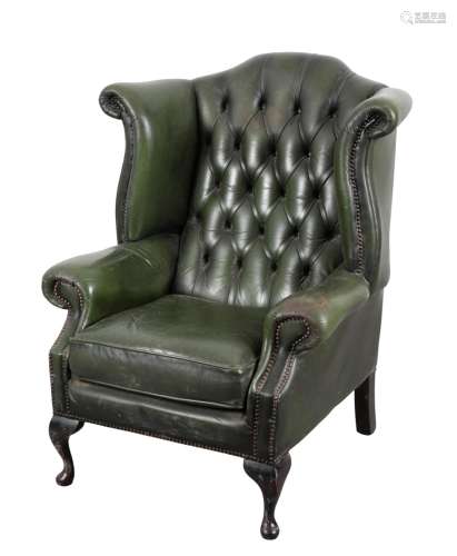 A GEORGE I STYLE WINGBACK ARMCHAIR
