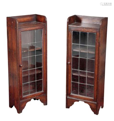 A PAIR OF 1930S OAK LEADED GLAZED BOOKCASES