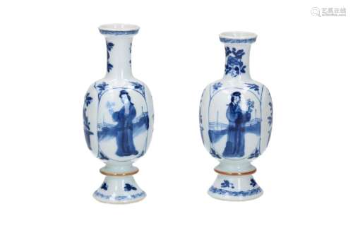 A pair of blue and white porcelain miniature vases with lobe...