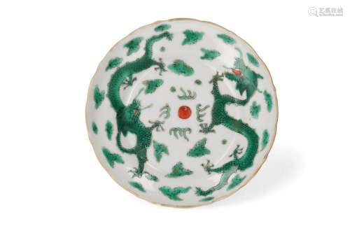 A polychrome porcelain saucer with scalloped rim