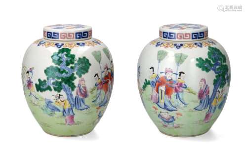 A pair of polychrome porcelain lidded jars