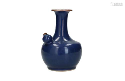 A blue glazed porcelain kendi