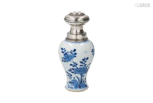 A blue and white porcelain tea caddy with silver cap and mou...