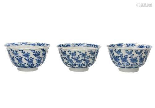 A set of three blue and white porcelain bowls with scalloped...