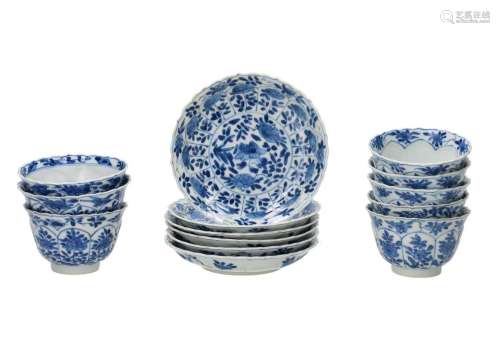A set of six blue and white porcelain cups with saucers with...