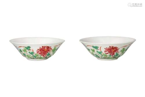 A pair of polychrome porcelain cups