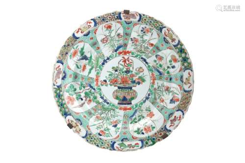 A famille verte porcelain charger with scalloped rim