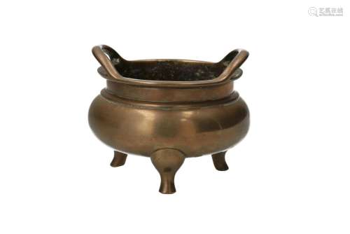 A bronze tripod censer with two handles