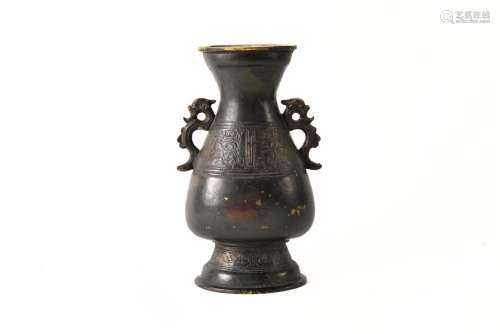A bronze archaic vase with two handles in the shape of drago...