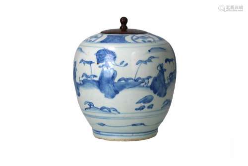 A blue and white porcelain jar with wooden lid