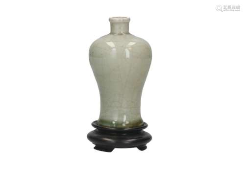 A celadon glazed Meiping vase on wooden base