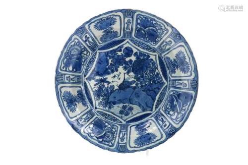 A blue and white porcelain deep charger with scalloped rim
