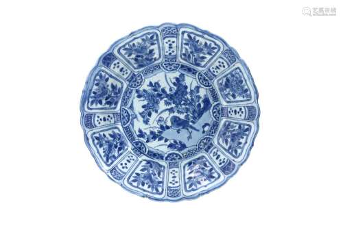 A blue and white porcelain deep charger with scalloped rim