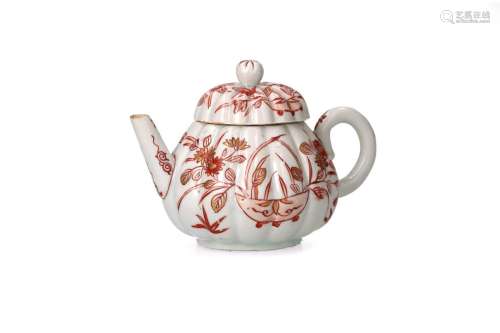 A red and white porcelain lobed teapot
