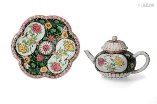 A famille rose porcelain teapot on flower-shaped dish