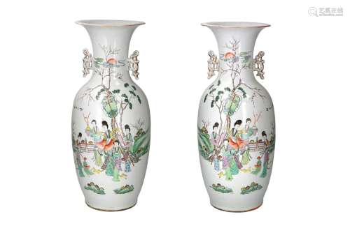 A pair of polychrome porcelain vases with two handles