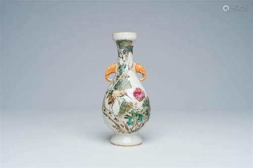 A Chinese qianjiang cai vase with a crane among blossoming b...