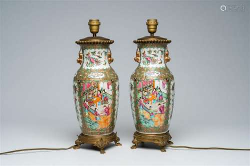 A pair of Chinese Canton famille rose vases with palace scen...