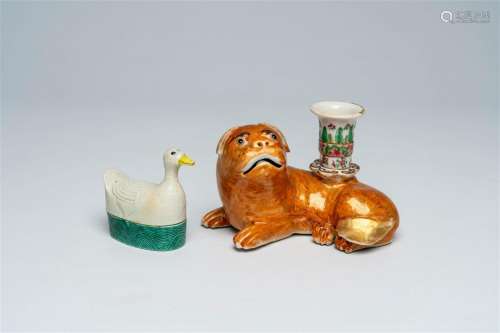 A Chinese Canton famille rose dog-shaped candlestick and a g...