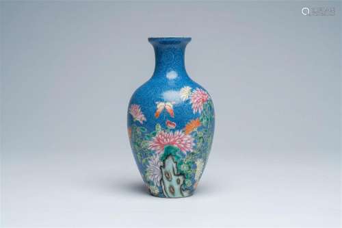 A Chinese famille rose blue-ground sgraffito vase with flora...