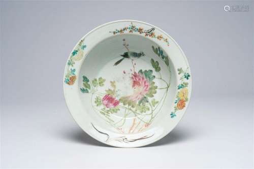 A Chinese qianjiang cai bowl with a bird on a blossoming bra...