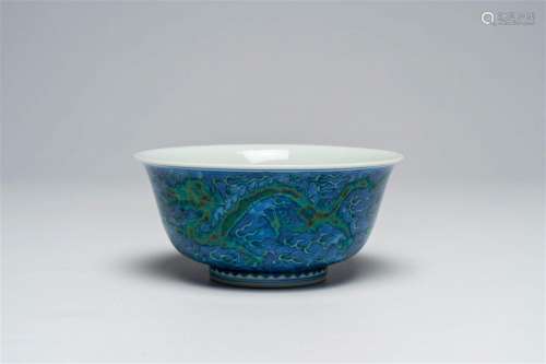 A Chinese blue, white and overglaze green 'dragons' bowl, Ka...