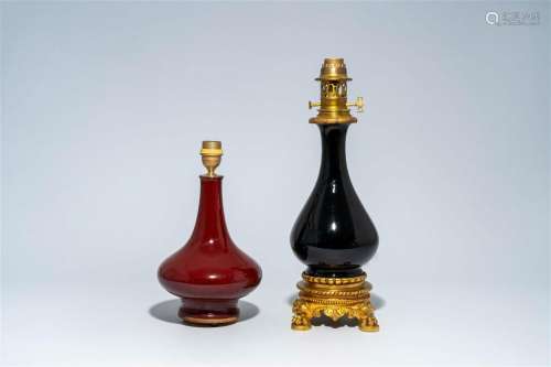 A Chinese monochrome red vase mounted as a lamp and a gilt b...