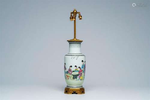 A Chinese famille rose vase with ladies in a garden mounted ...