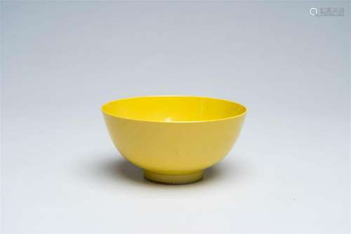 A Chinese monochrome yellow bowl, Qianlong mark, 19th/20th C...